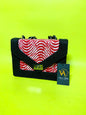 Black handbag with red and white pattern on a bright yellow background, featuring a View Afric tag.